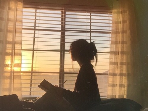 Girl looking at sunset