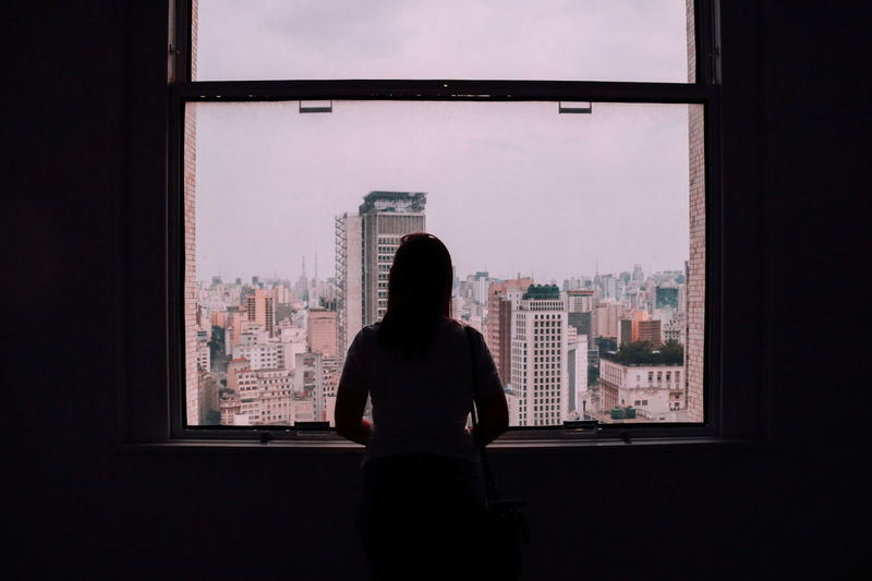 girl looking out window