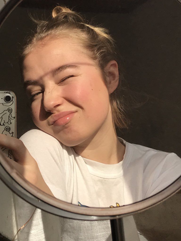 girl smiling in mirror