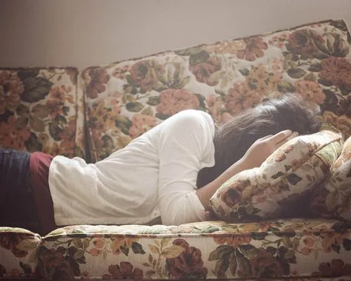sad girl on sofa