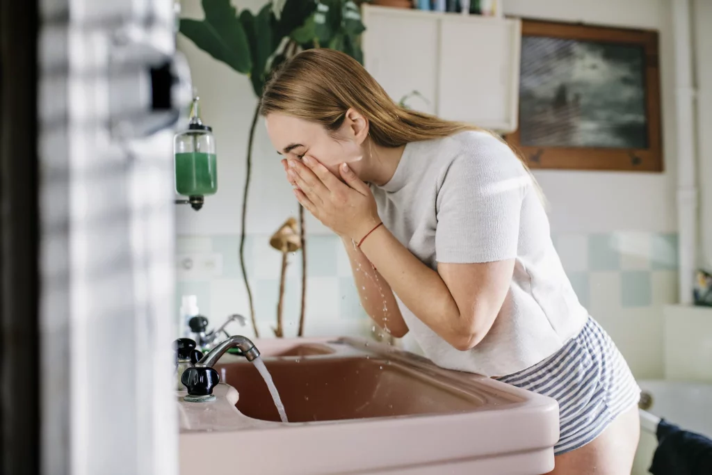 Girl washing face