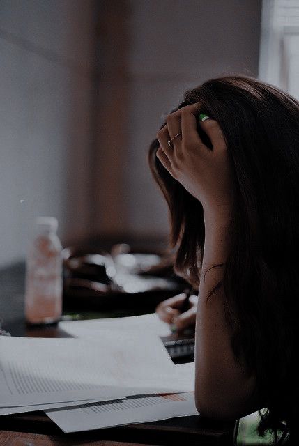 girl writing on desk