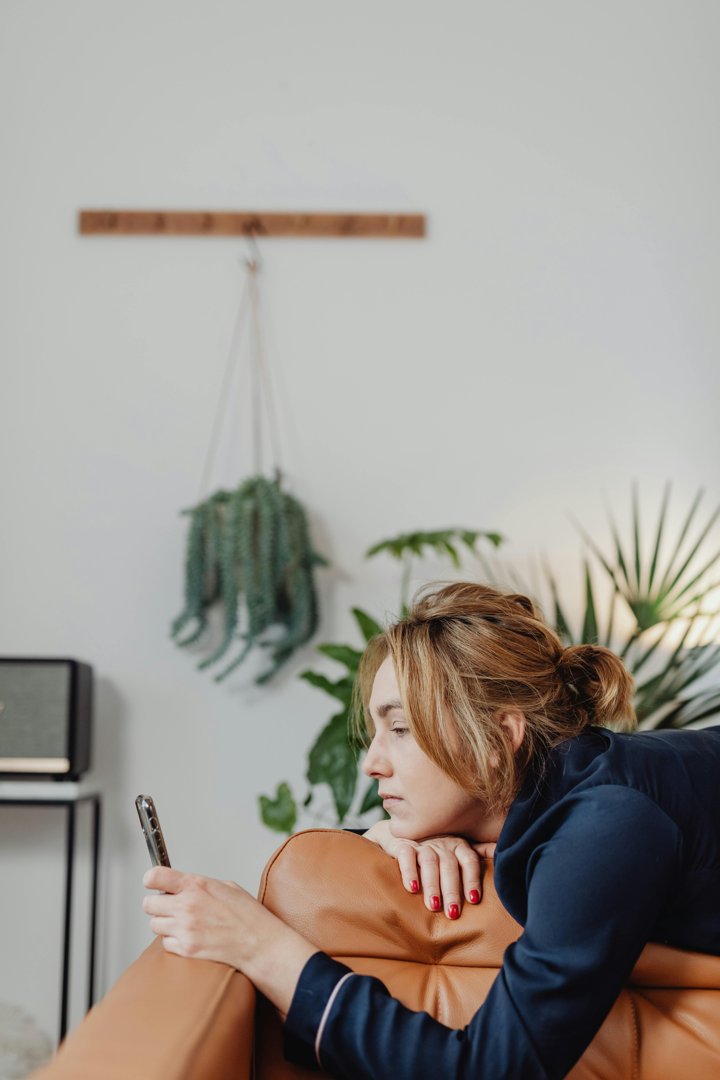 A woman looking through a phone | Source: Pexels