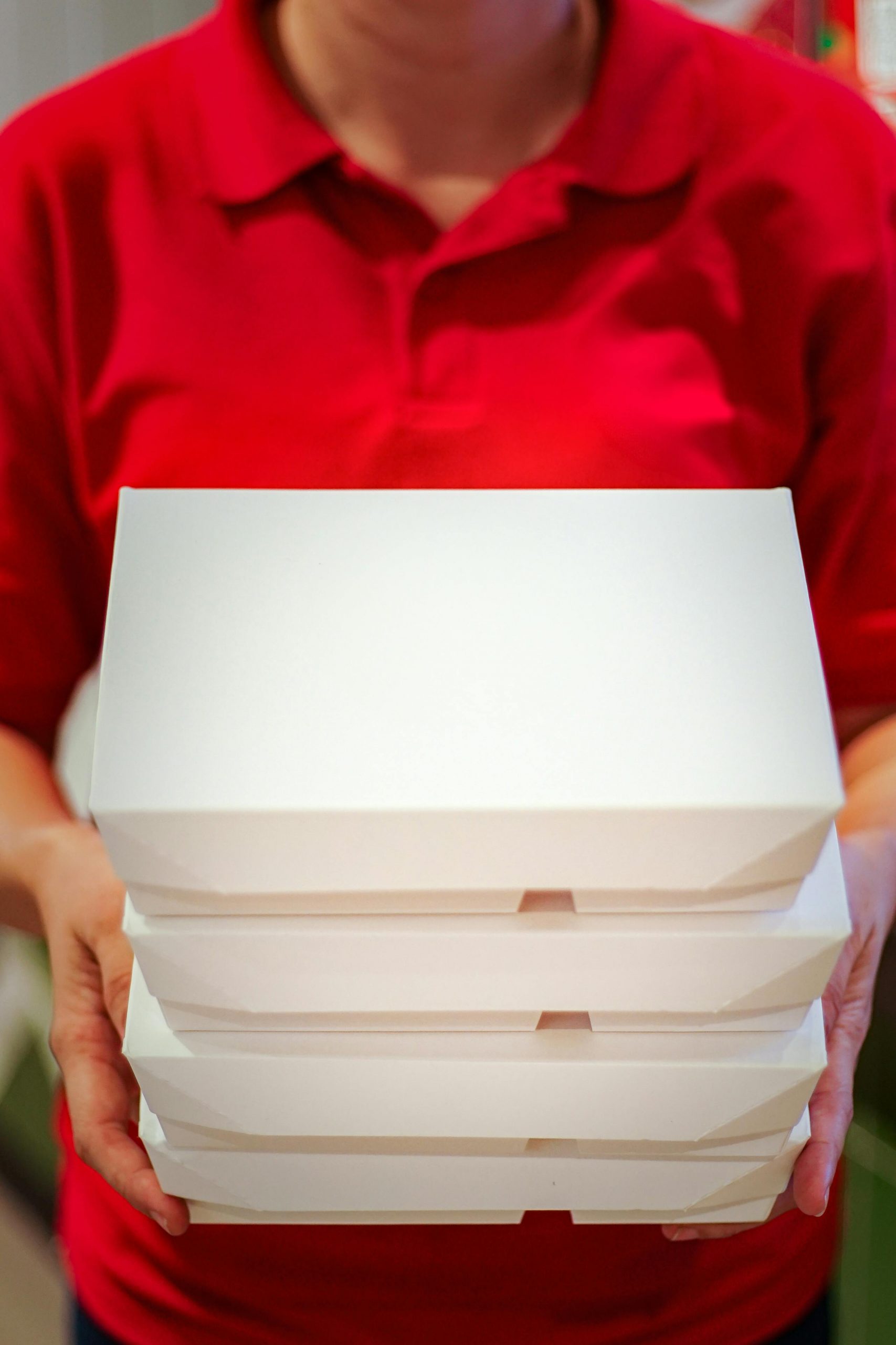 Someone holding takeout containers | Source: Pexels