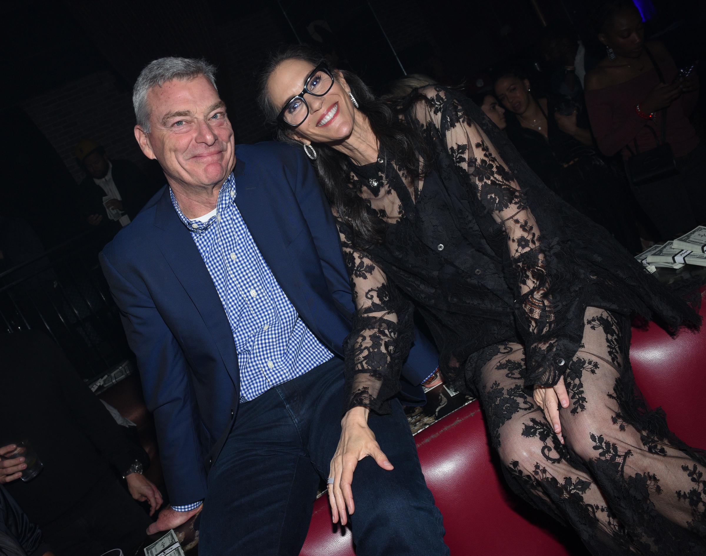 Pictured alongside Tony Ressler, Jami Gertz exuded glamour in a sheer black lace dress at the 