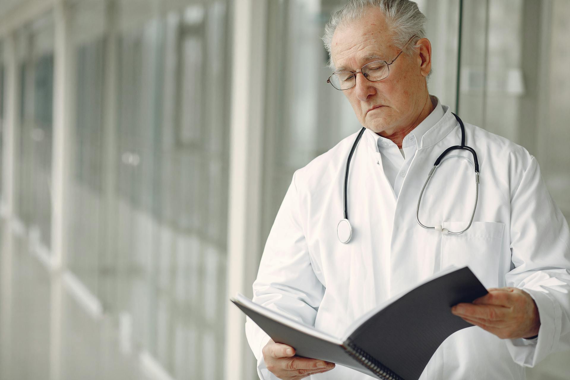 A doctor reading a report | Source: Pexels
