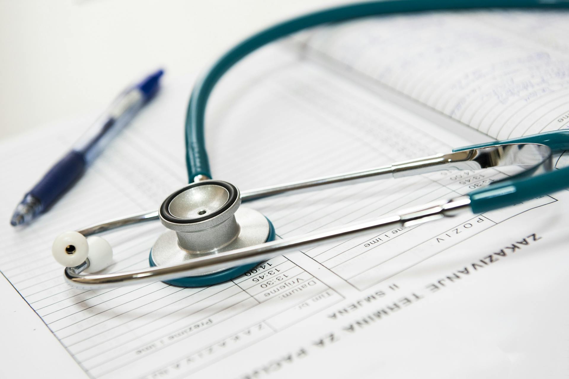 A stethoscope on a doctor's report | Source: Pexels