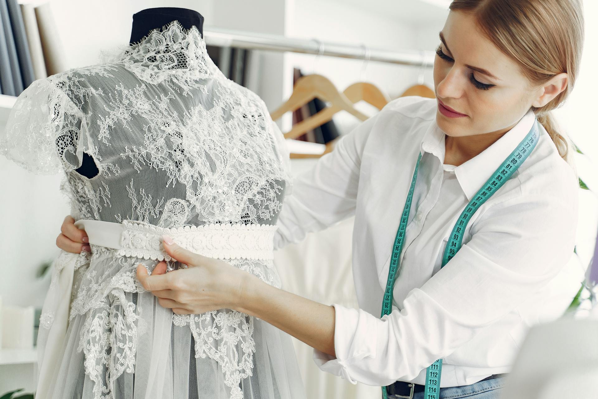 A female dressmaker creating a wedding gown in her shop | Source: Pexels