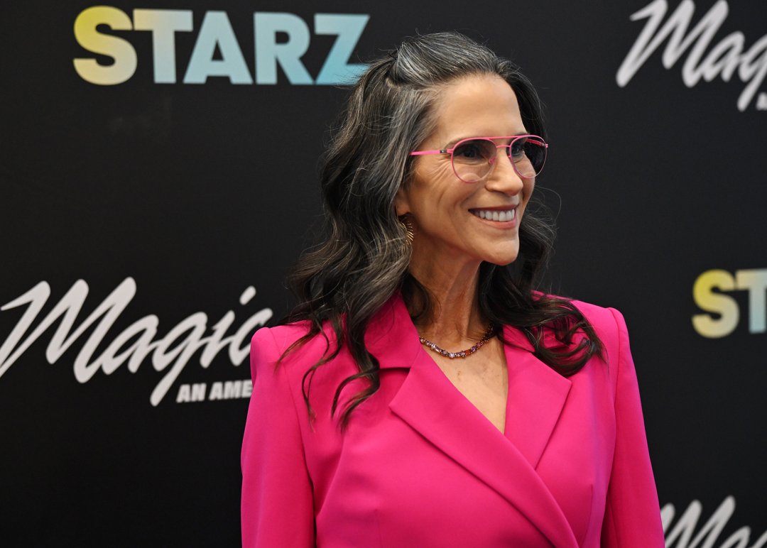 Glowing in a hot pink suit and matching frames, Jami Gertz lit up the 