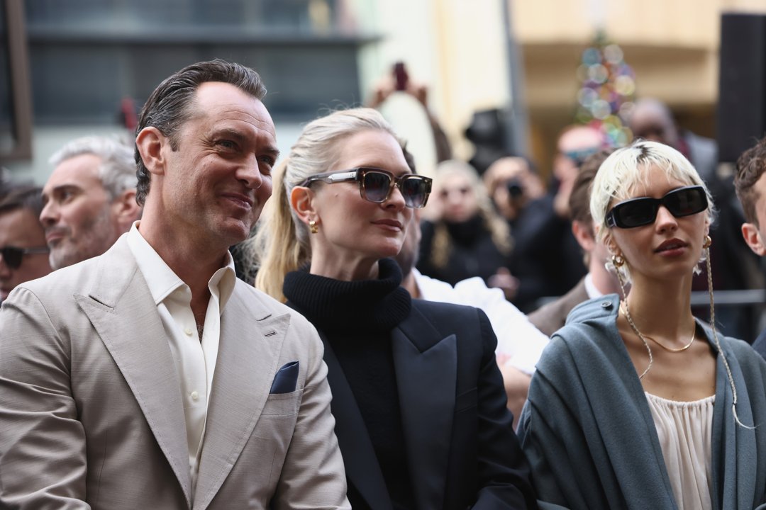 Jude Law, Phillipa Coan, and Iris Law at his Hollywood Walk of Fame Star Ceremony on December 12, 2024, in California. | Source: Getty Images