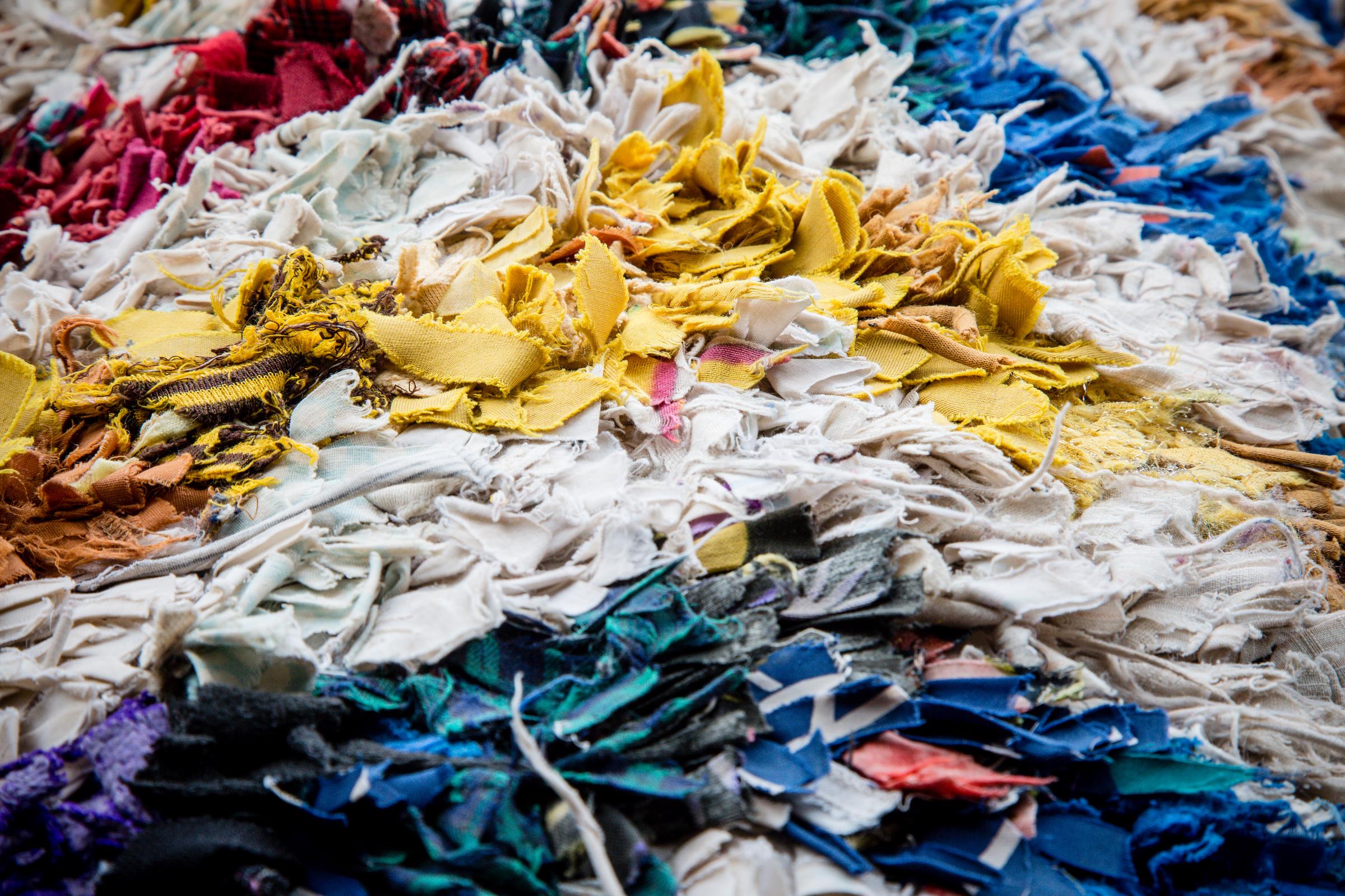 Colorful pieces of shredded fabric | Source: Shutterstock