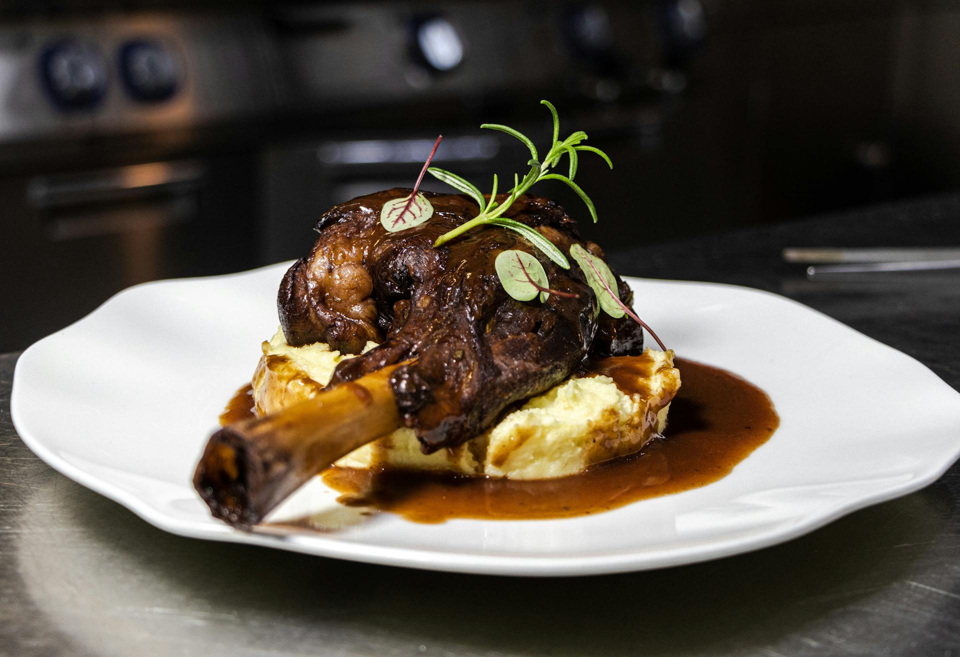 A plate of roasted lamb with mashed potatoes and rosemary | Source: Pexels