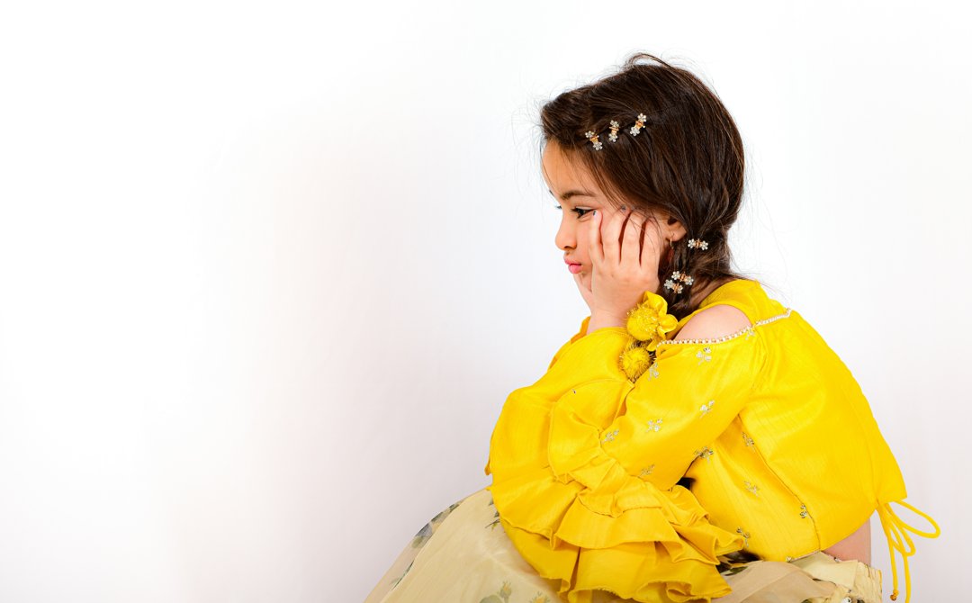 A girl with her hands on her cheeks | Source: Unsplash