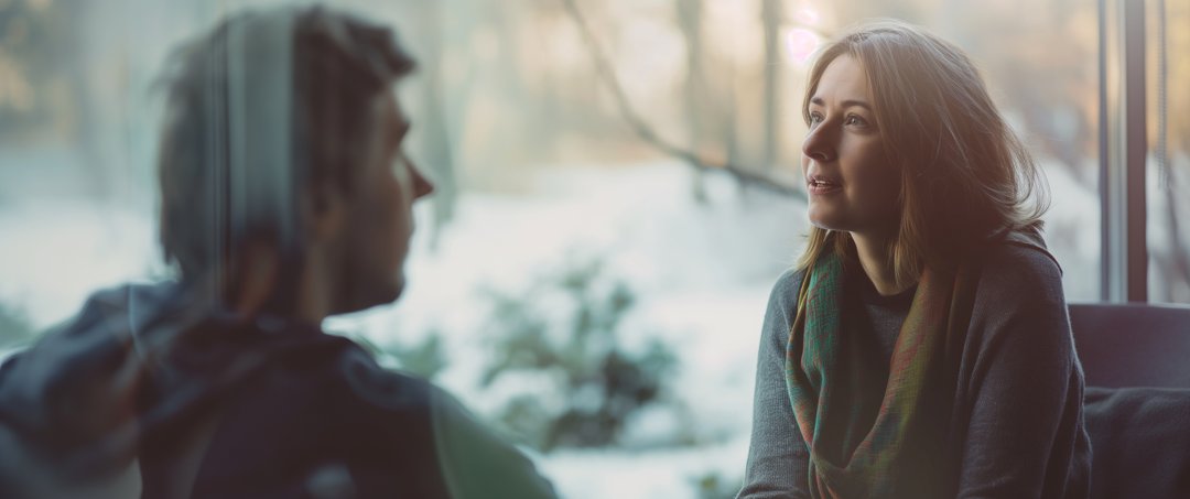 A woman talking to a man | Source: Midjourney