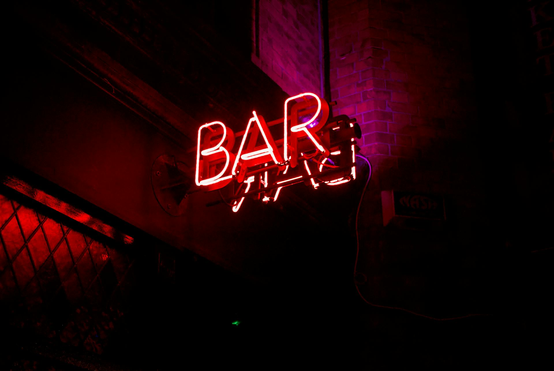 A neon sign above a bar | Source: Pexels