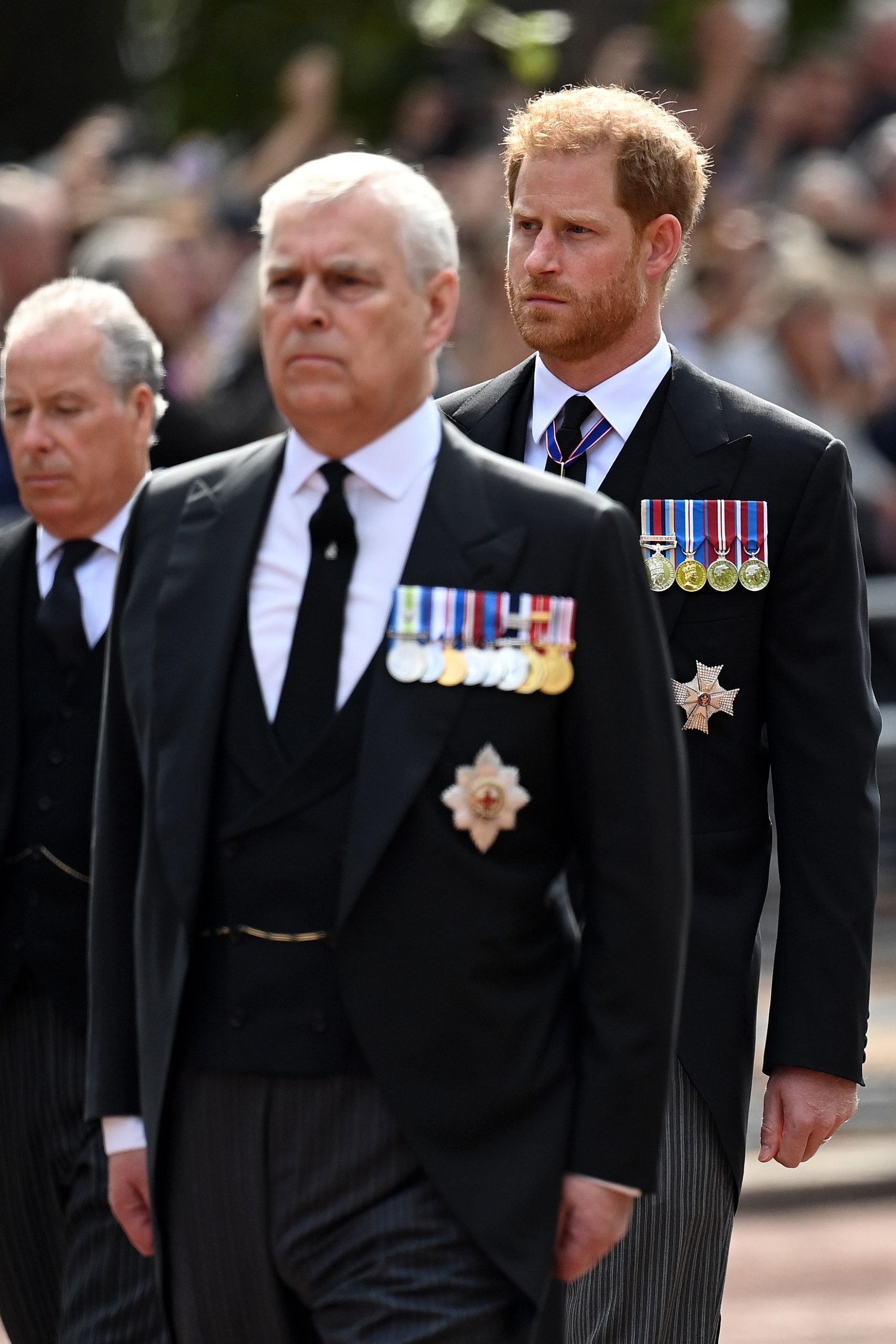 Prince Andrew and Prince Harry walk behind the coffin during the procession for the Lying-in State of Queen Elizabeth II on September 14, 2022, in London, England. | Source: Getty Images