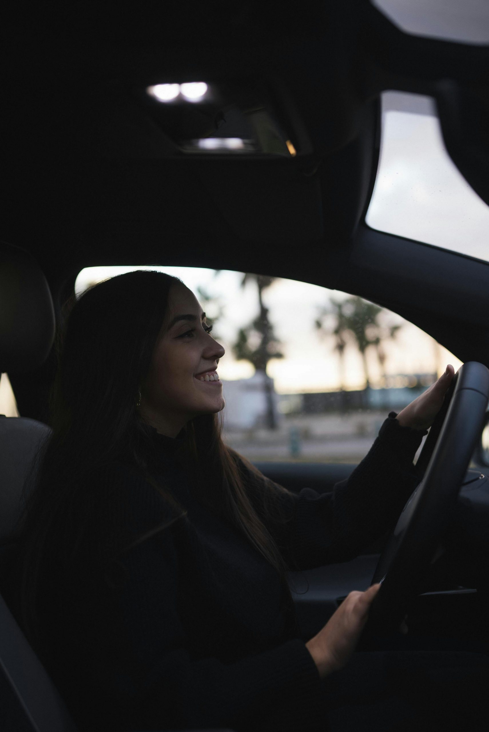 A happy woman driving | Source: Pexels