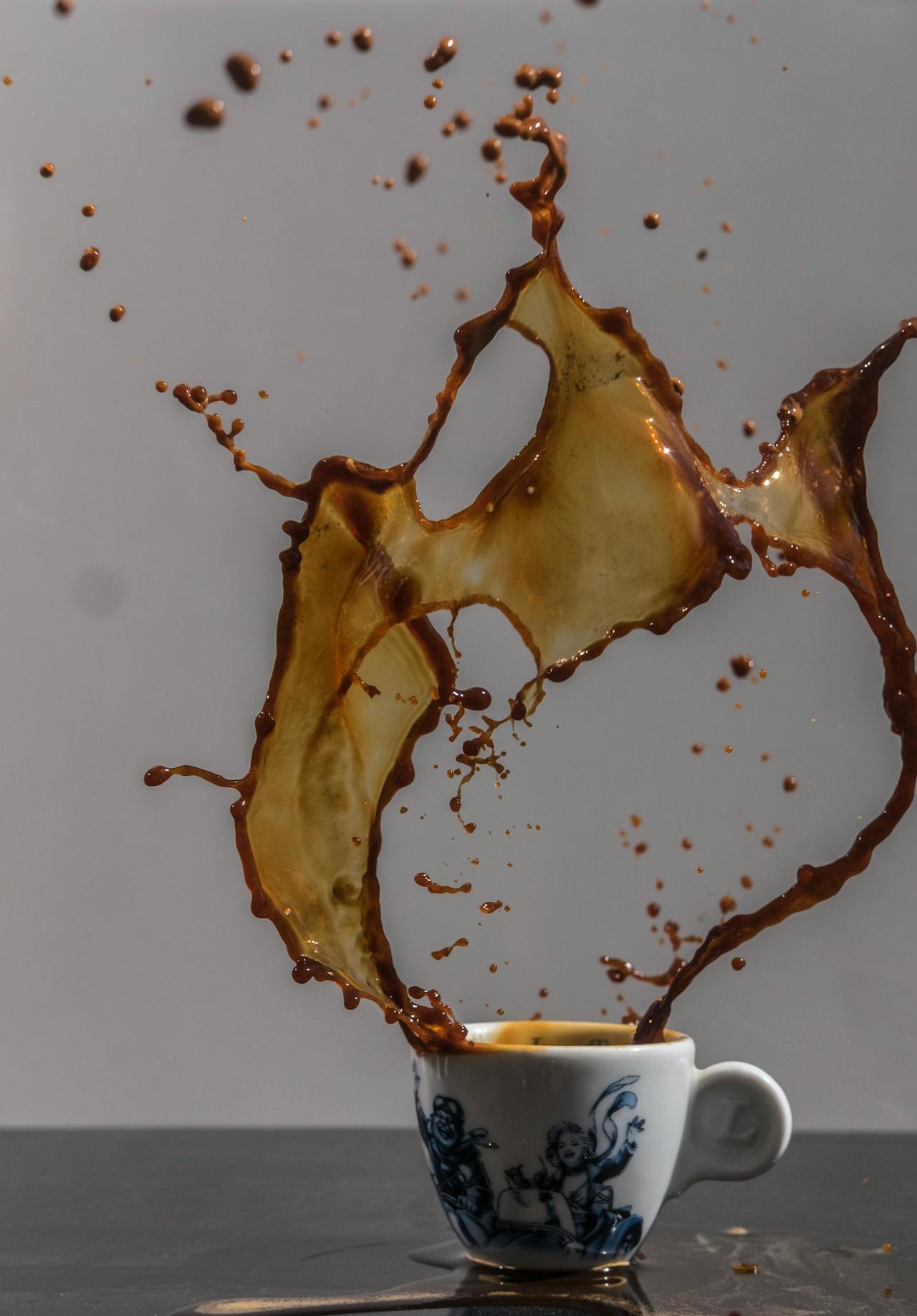 Coffee splashing from a ceramic cup | Source: Pexels