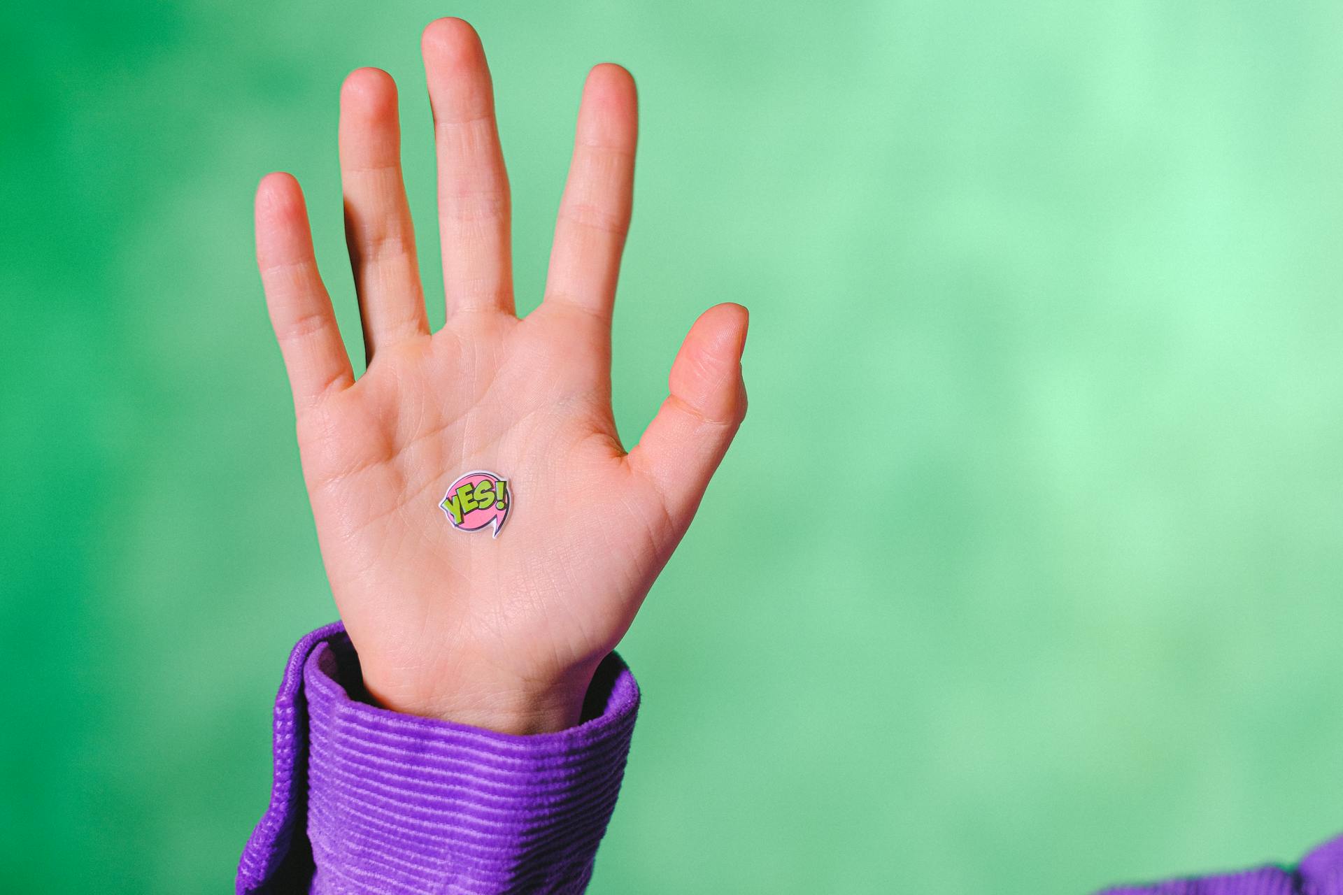 A raised hand with the