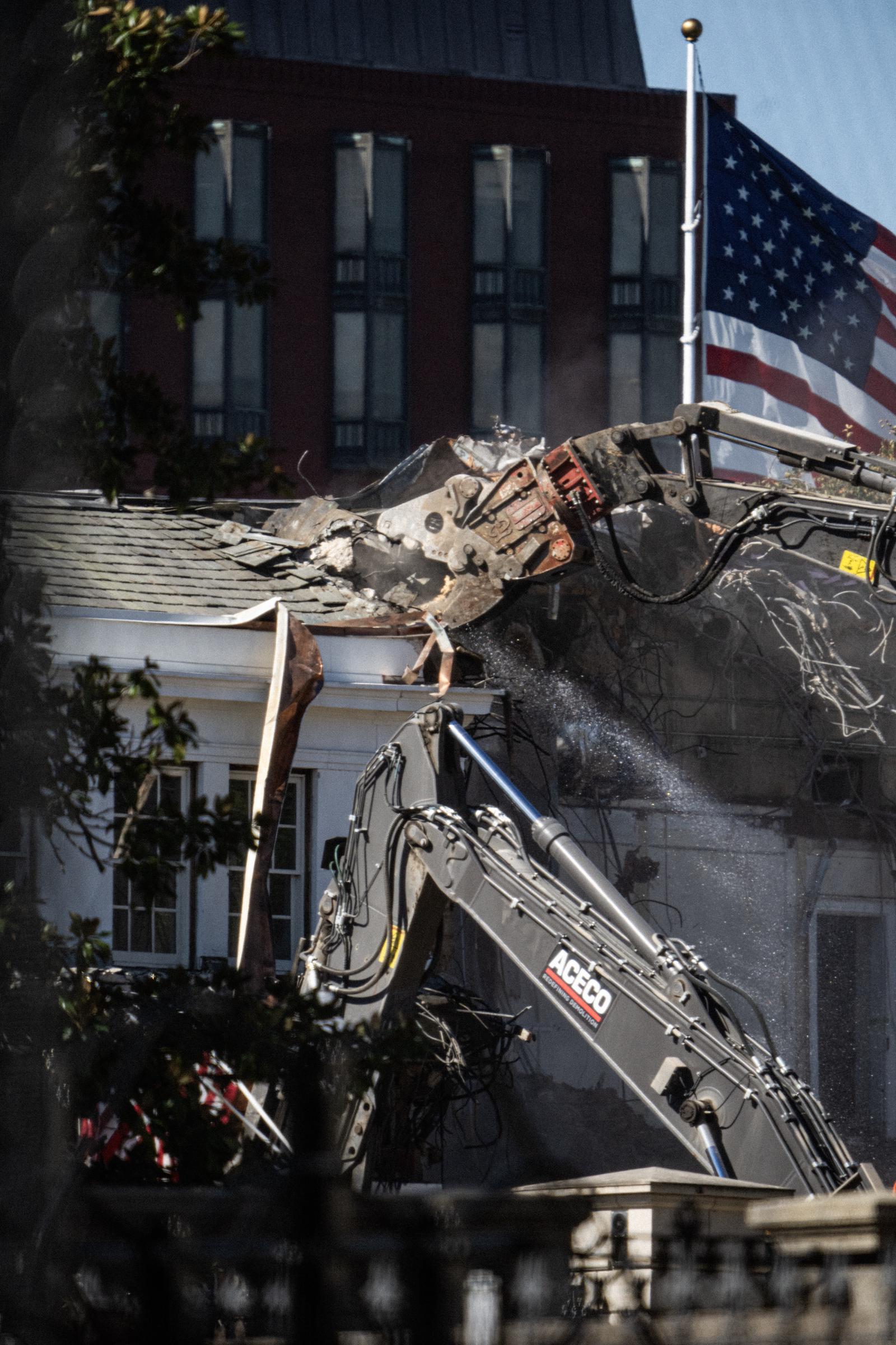 Heavy equipment demolishes a portion of the East Wing of the White House in preparation for construction of a new ballroom on October 21, 2025 | Source: Getty Images