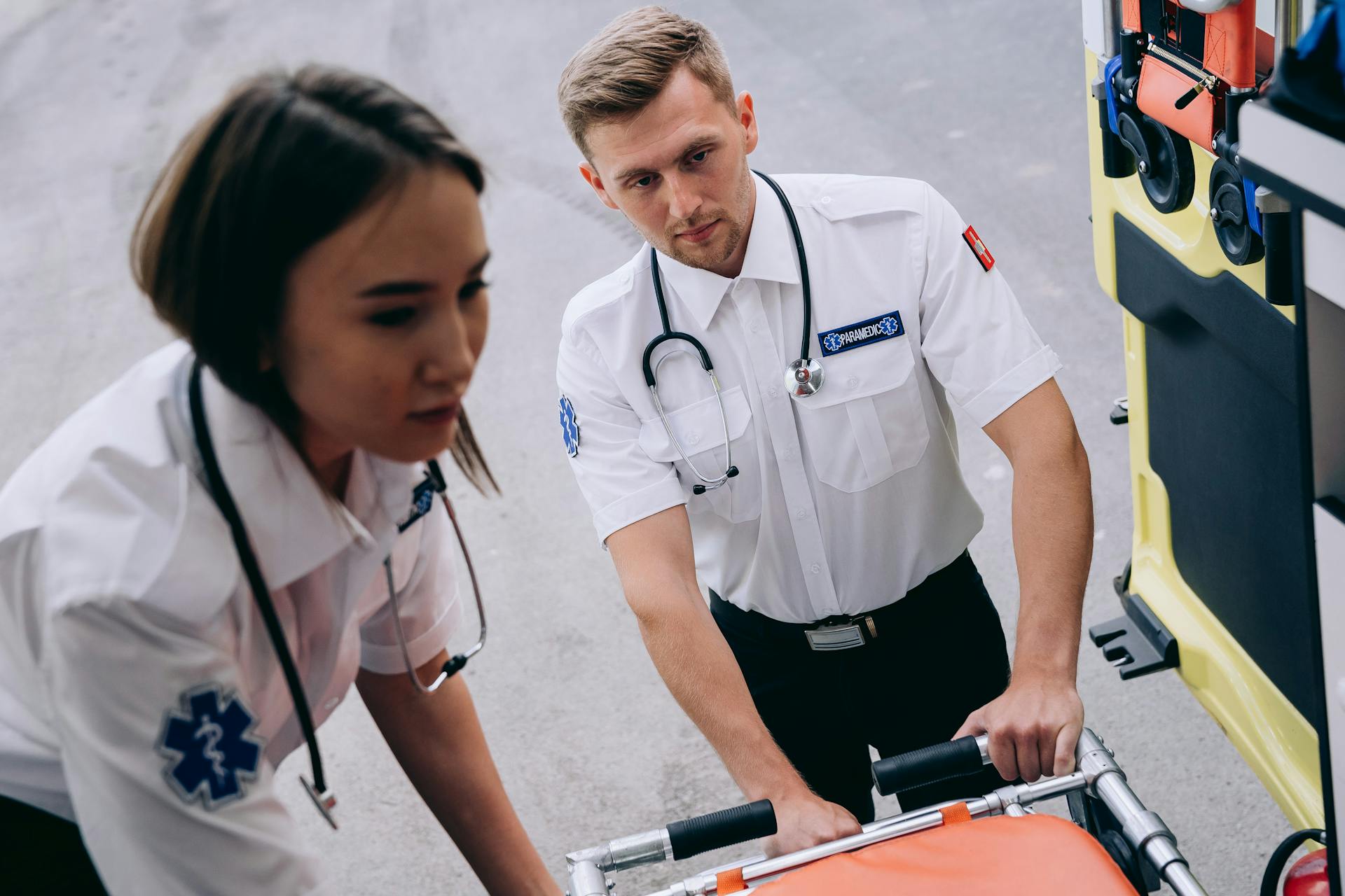 Two paramedics standing near an ambulance | Source: Pexels