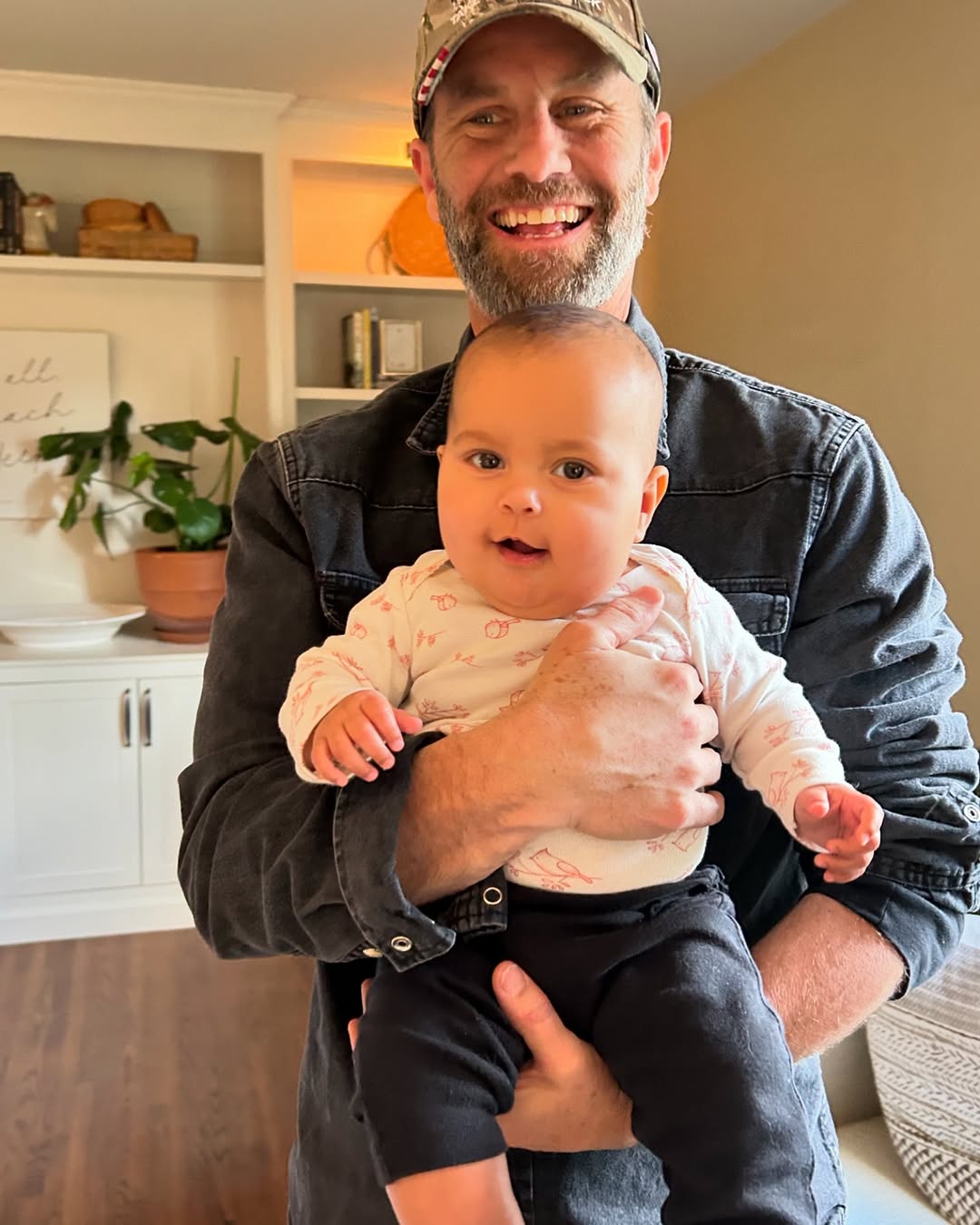 Kirk Cameron poses with his grandchild, seen in a post dated December 13, 2024 | Source: Instagram/kirkcameronofficial