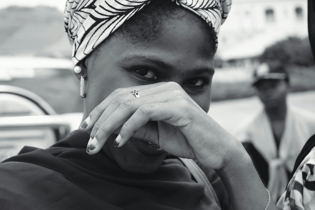 A woman covering her face | Source: Unsplash