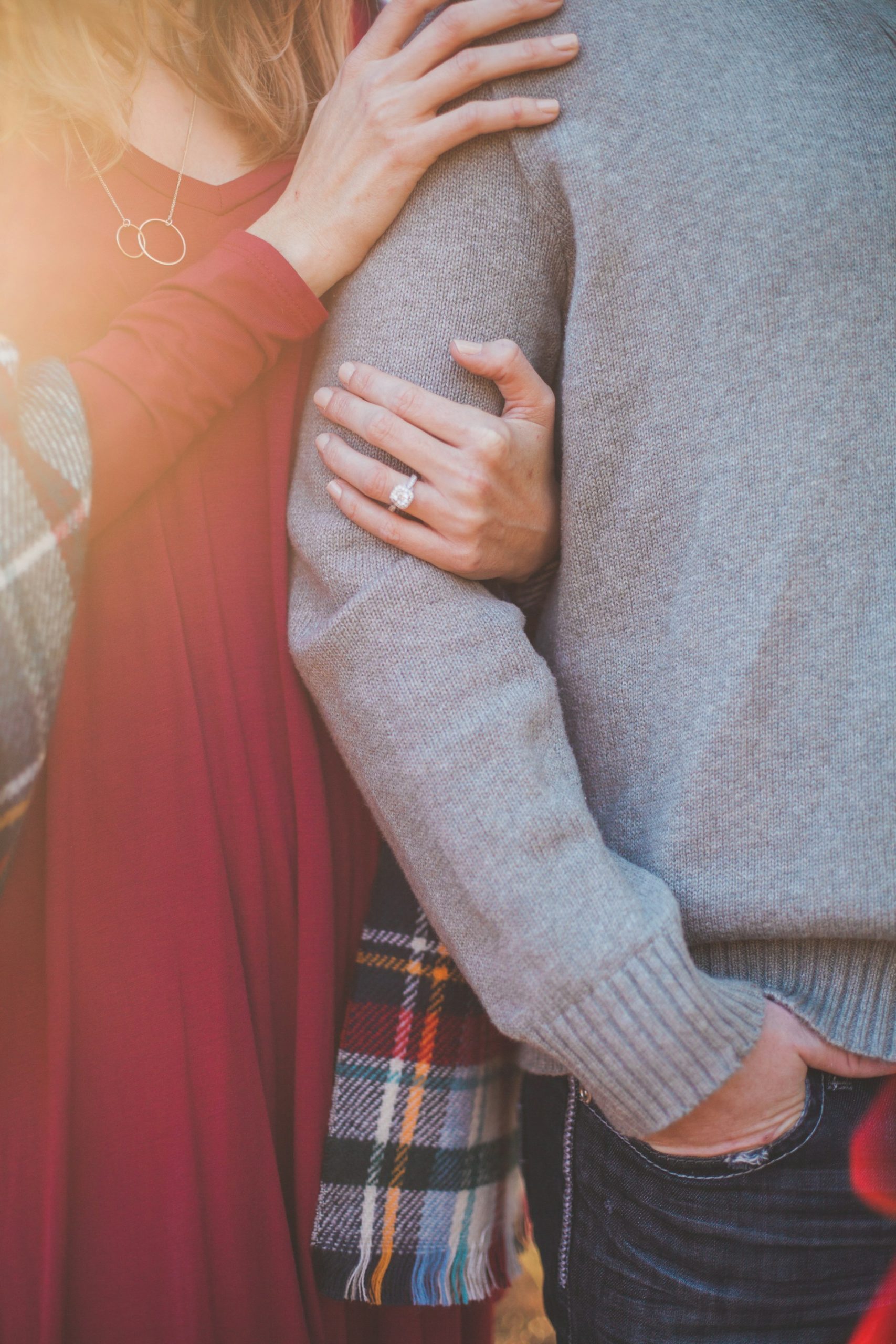 A woman holding a man's arm | Source: Unsplash