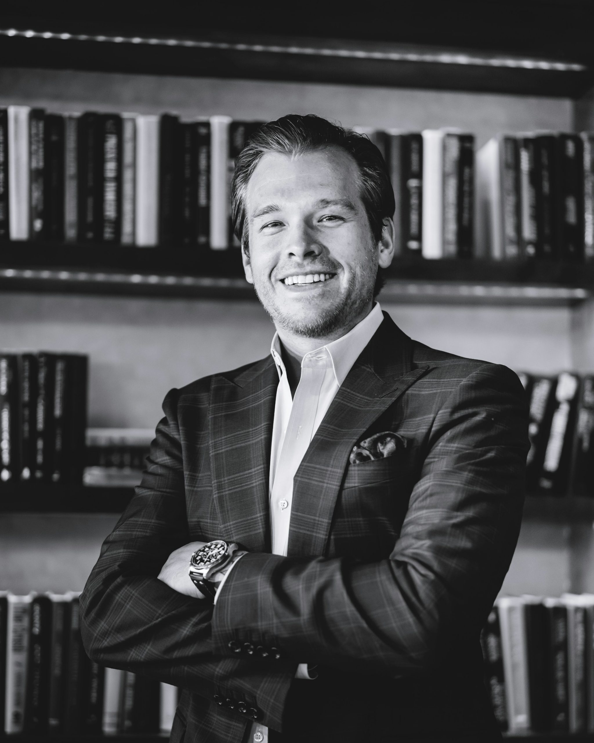 A smiling man wearing a suit | Source: Unsplash
