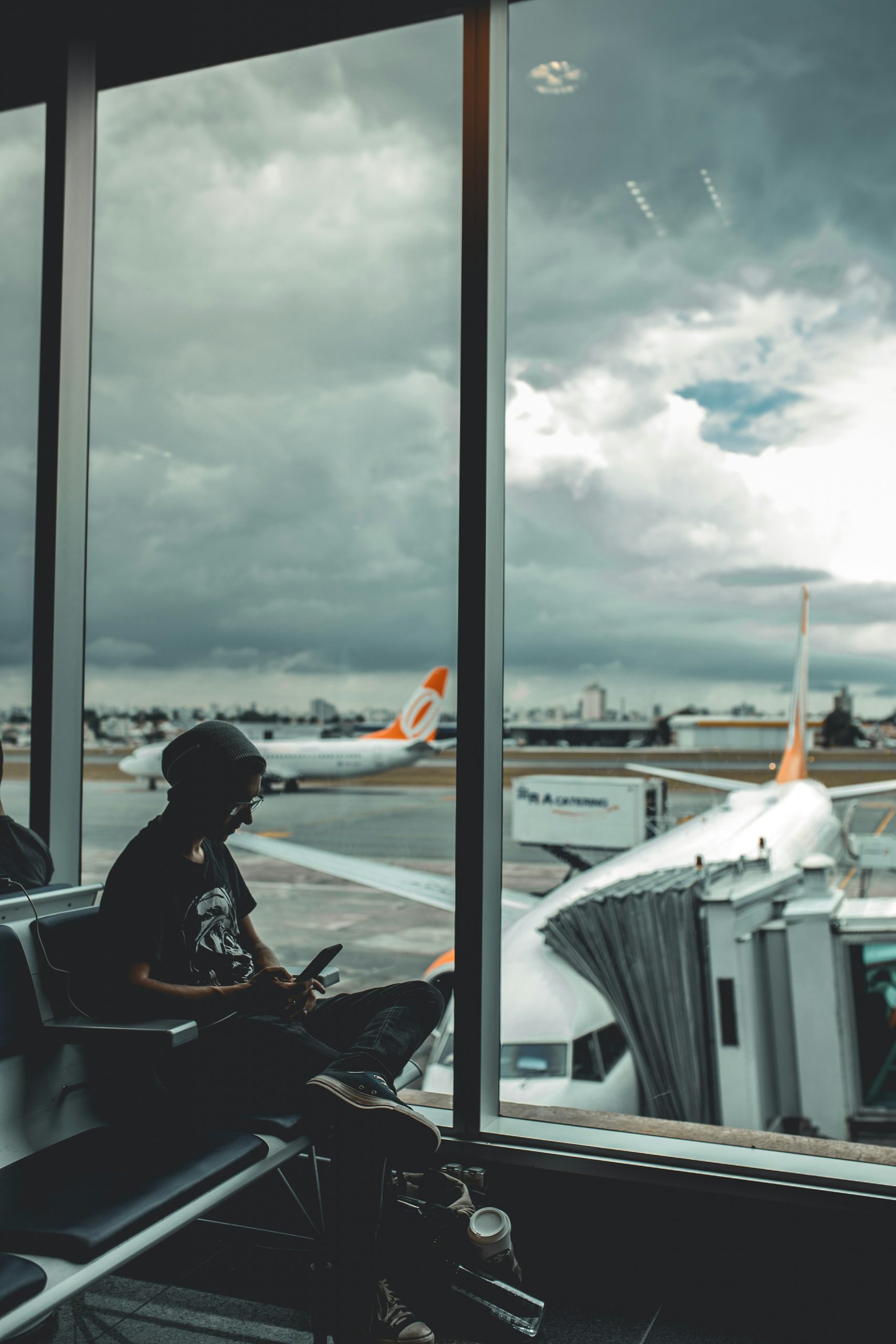 A person sitting at the airport | Source: Unsplash