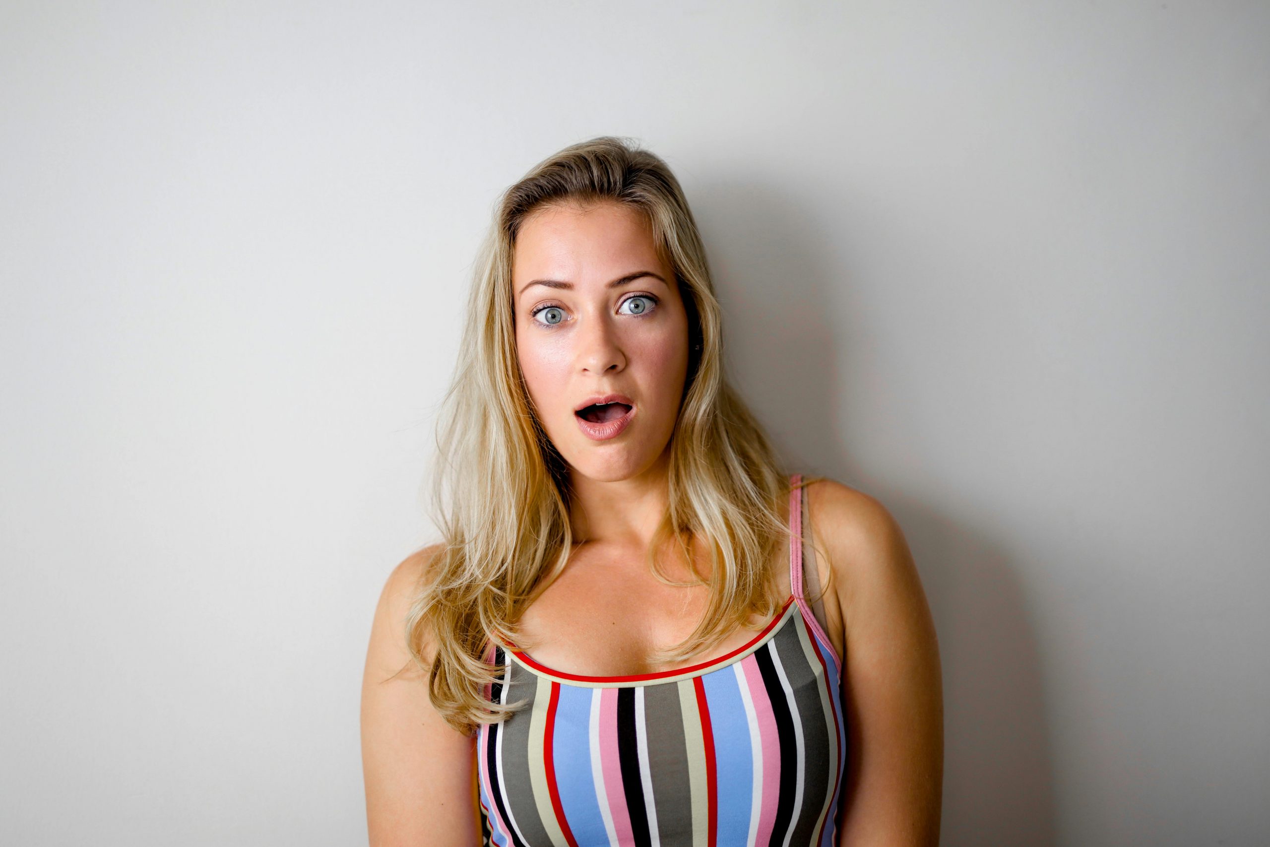 A shocked blonde woman | Source: Pexels