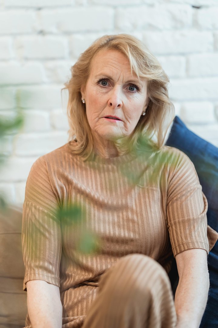 A close up of an older woman wearing brown | Source: Pexels