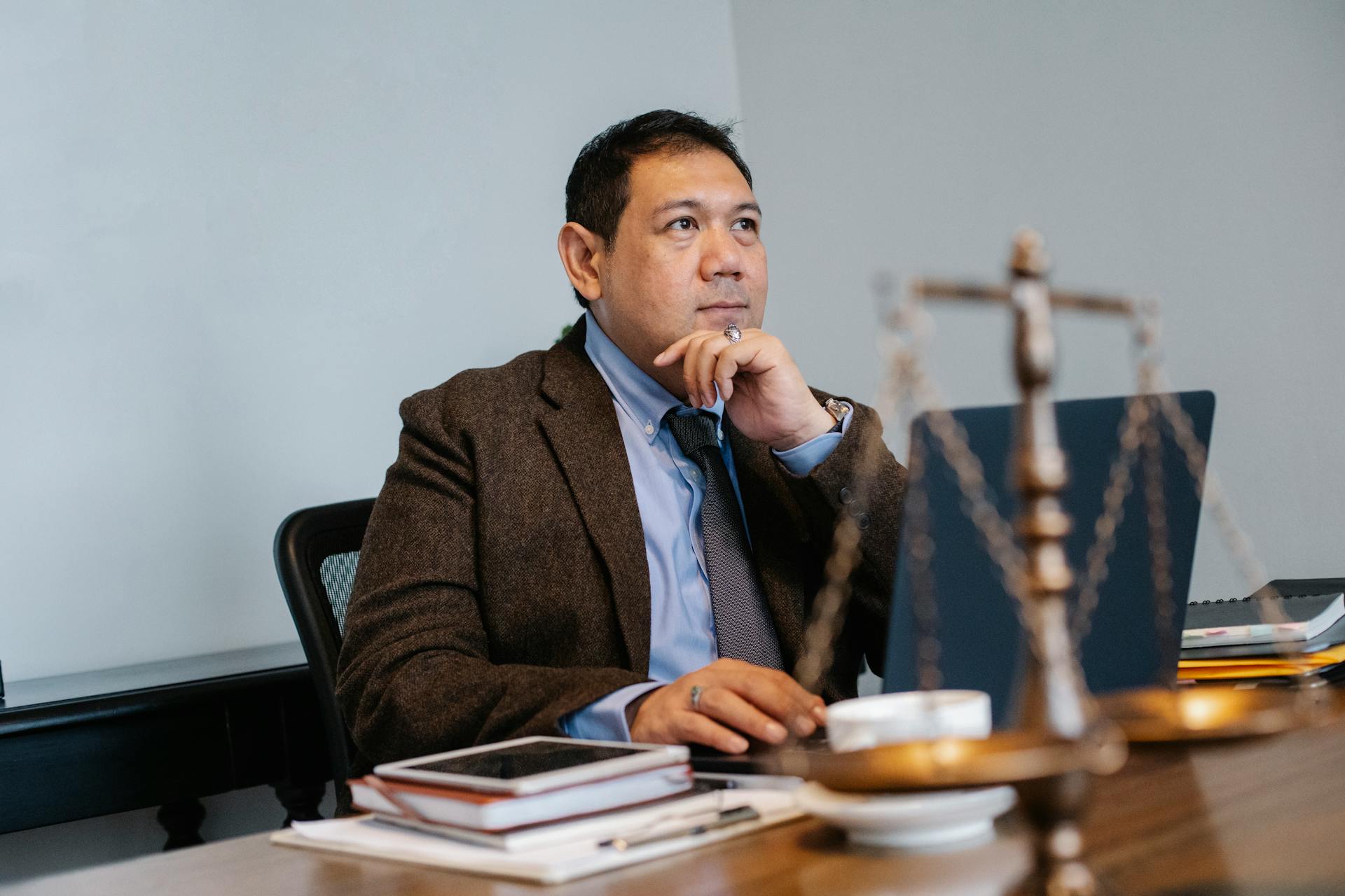 A lawyer sitting in his office | Source: Pexels