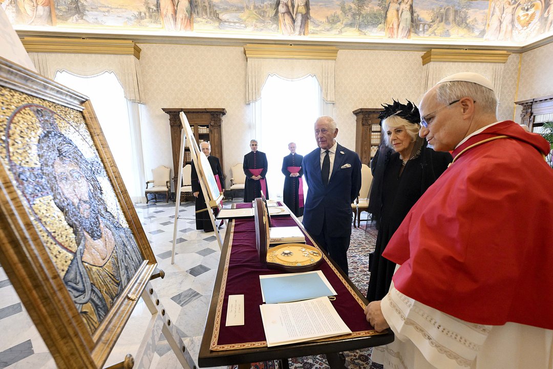 Pope Leo XVI exchanges gifts with King Charles III and Queen Camilla during an audience at the Apostolic Palace in Vatican City | Source: Getty Images