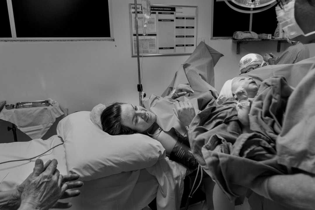 A woman reaching out for her newborn baby | Source: Pexels