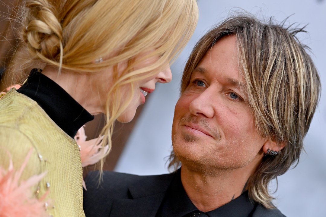 Nicole Kidman leans toward Keith Urban as they pose together at the Los Angeles premiere of 