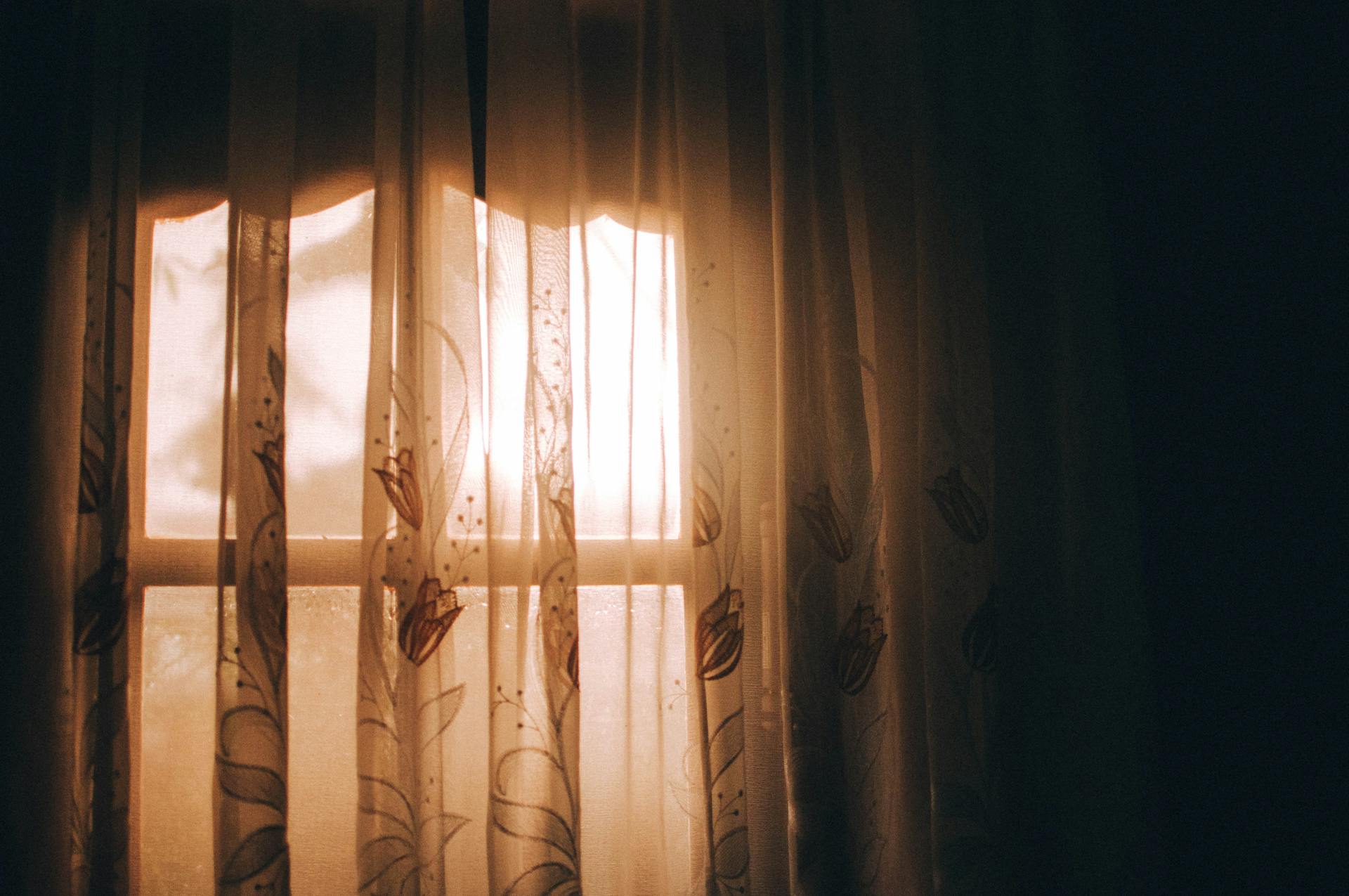 Light shining through curtains | Source: Pexels