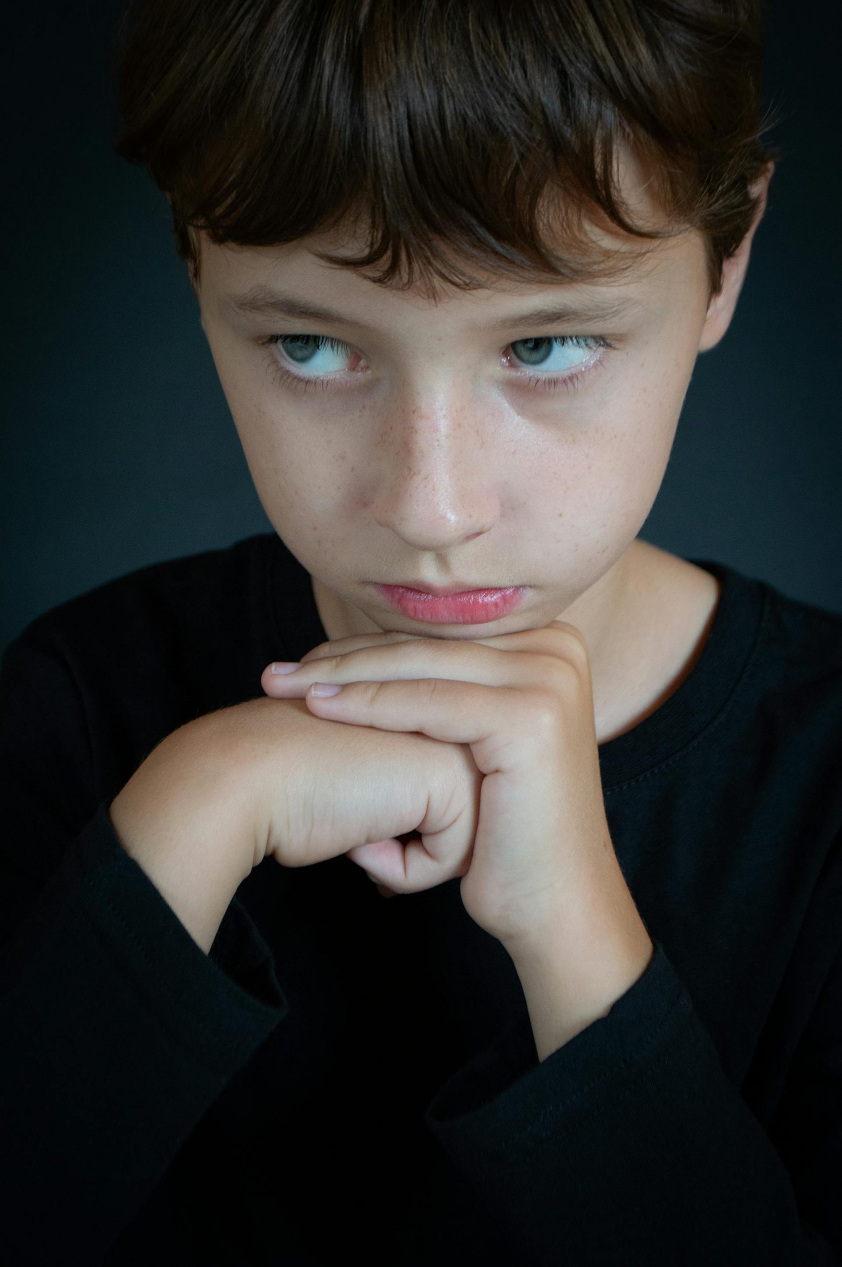 A boy in a black shirt | Source: Pexels