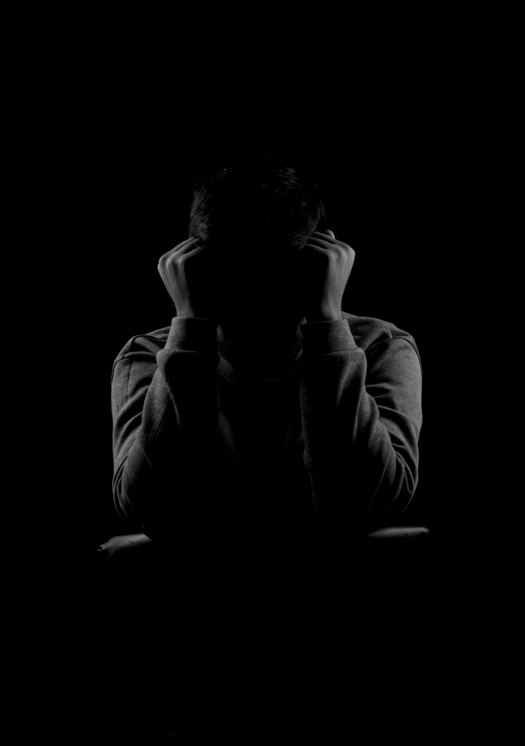 A grayscale shot of a distraught man | Source: Pexels