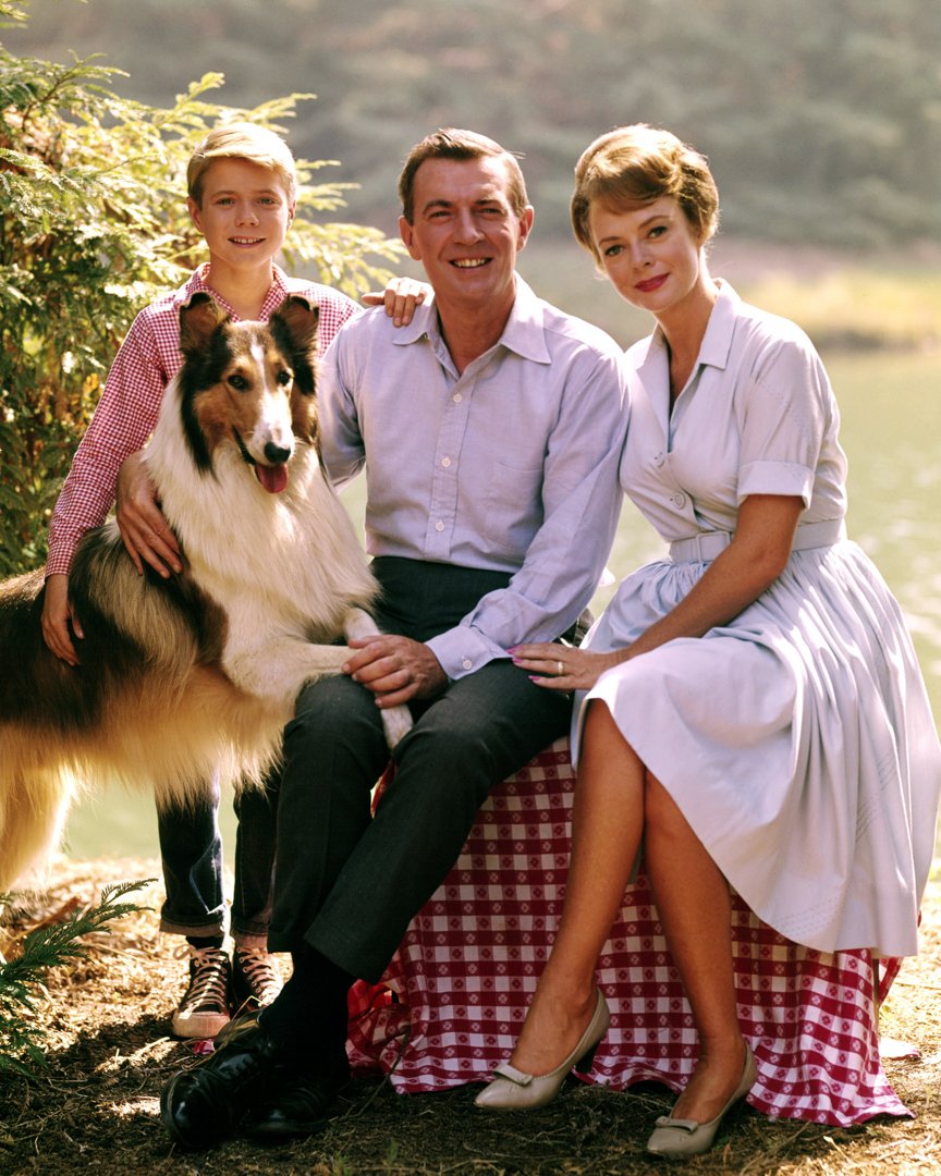 Lassie poses with Jon Provost, June Lockhart, and Hugh Reilly (1915-1998) for a group portrait issued as publicity for the US television series,