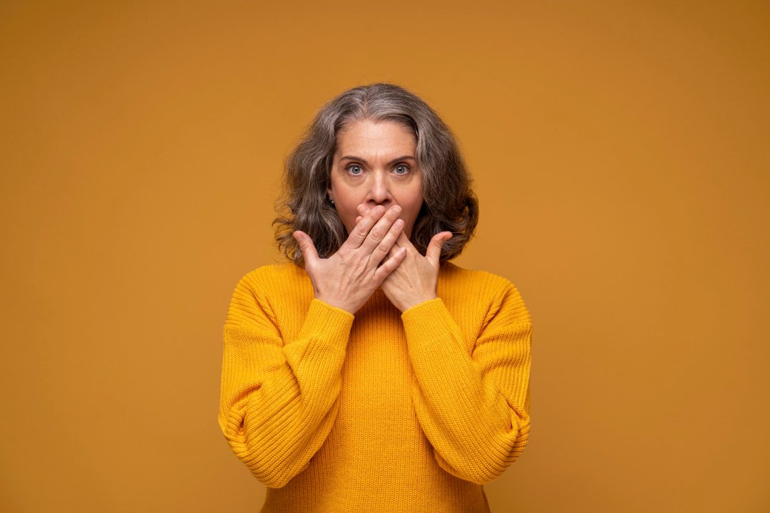 A stunned senior woman | Source: Freepik