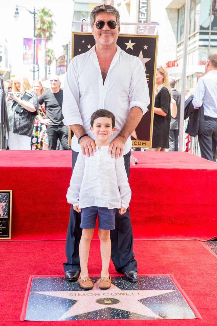 Simon and Eric Cowell at Simon's Star on the Hollywood Walk of Fame ceremony on August 22, 2018, in California | Source: Getty Images