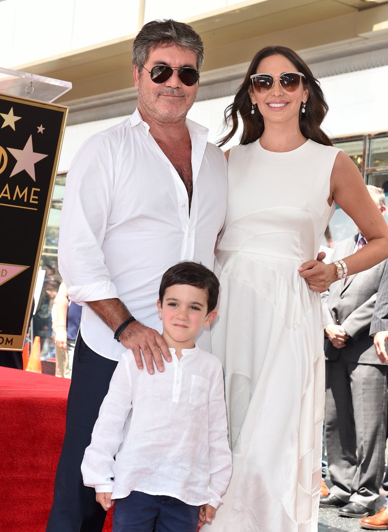 Simon and Eric Cowell with Lauren Silverman at Simon's Star on the Hollywood Walk of Fame ceremony on August 22, 2018, in California | Source: Getty Images