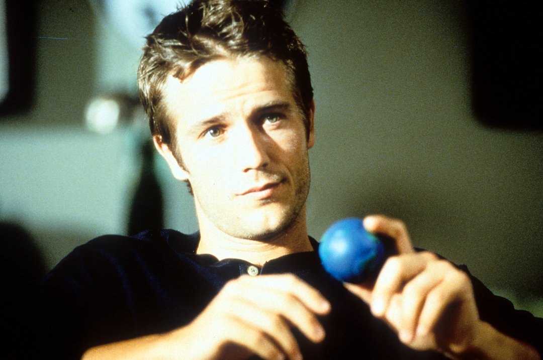 Michael Vartan holds a small blue ball in a scene from the 1998 film