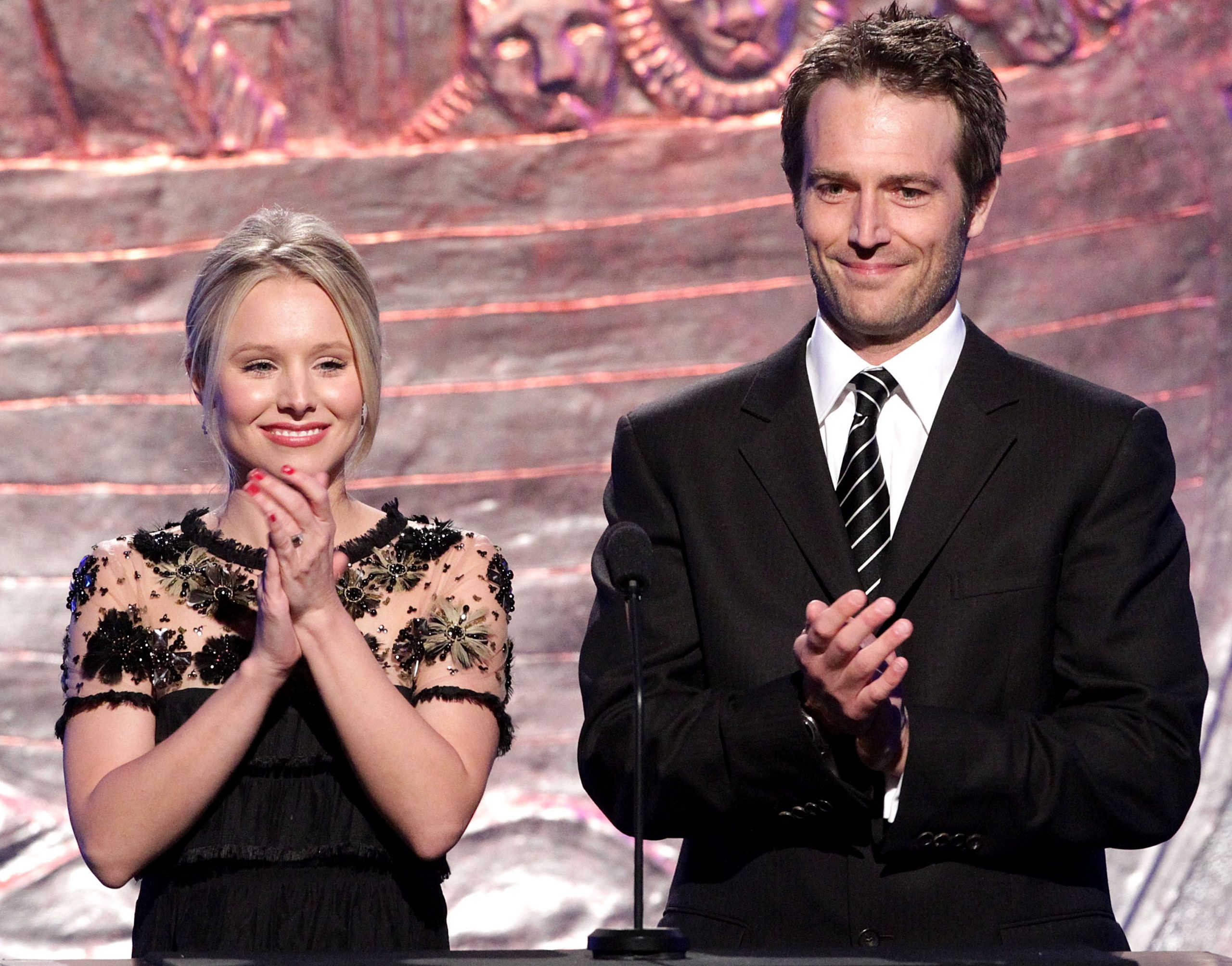 Kristen Bell and Michael Vartan speak during the 24th Genesis Awards in California. The pair share a poised moment on stage, with Vartan — now in his early 40s — showing subtle signs of maturity that add to his charm.