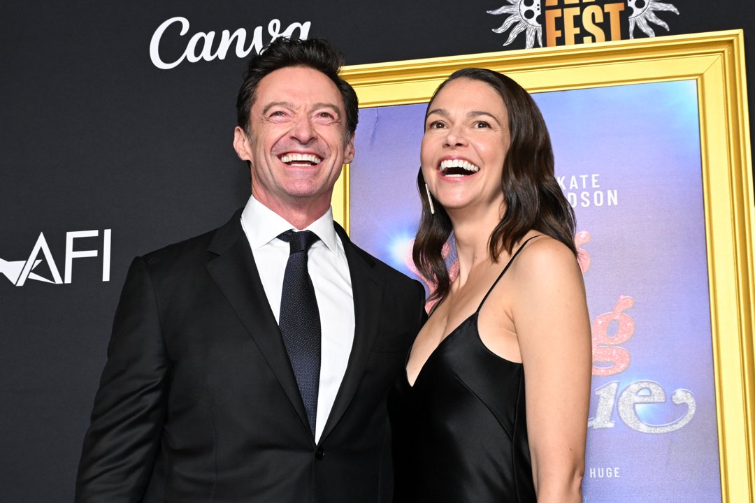 Hugh Jackman and Sutton Foster smile while attending the closing night gala premiere of 