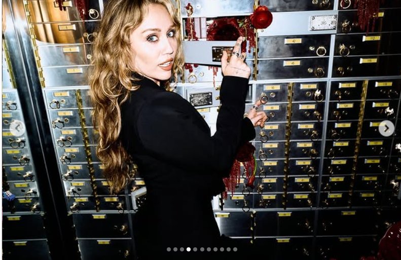 Miley Cyrus strikes a playful yet commanding pose in front of a wall of metallic safety deposit boxes, as seen from her post dated October 25, 2025 | Source: Instagram/mileycyrus