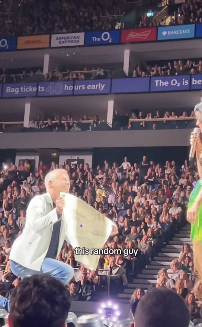 A man named Darren gets down on one knee to propose to Katy Perry during her concert at the O2 Arena in London on October 13, 2025. | Source: TikTok/@charl_robbins