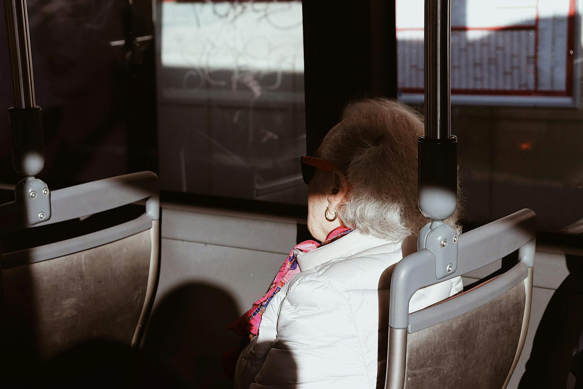 An elderly woman sitting on the bus | Source: Pexels