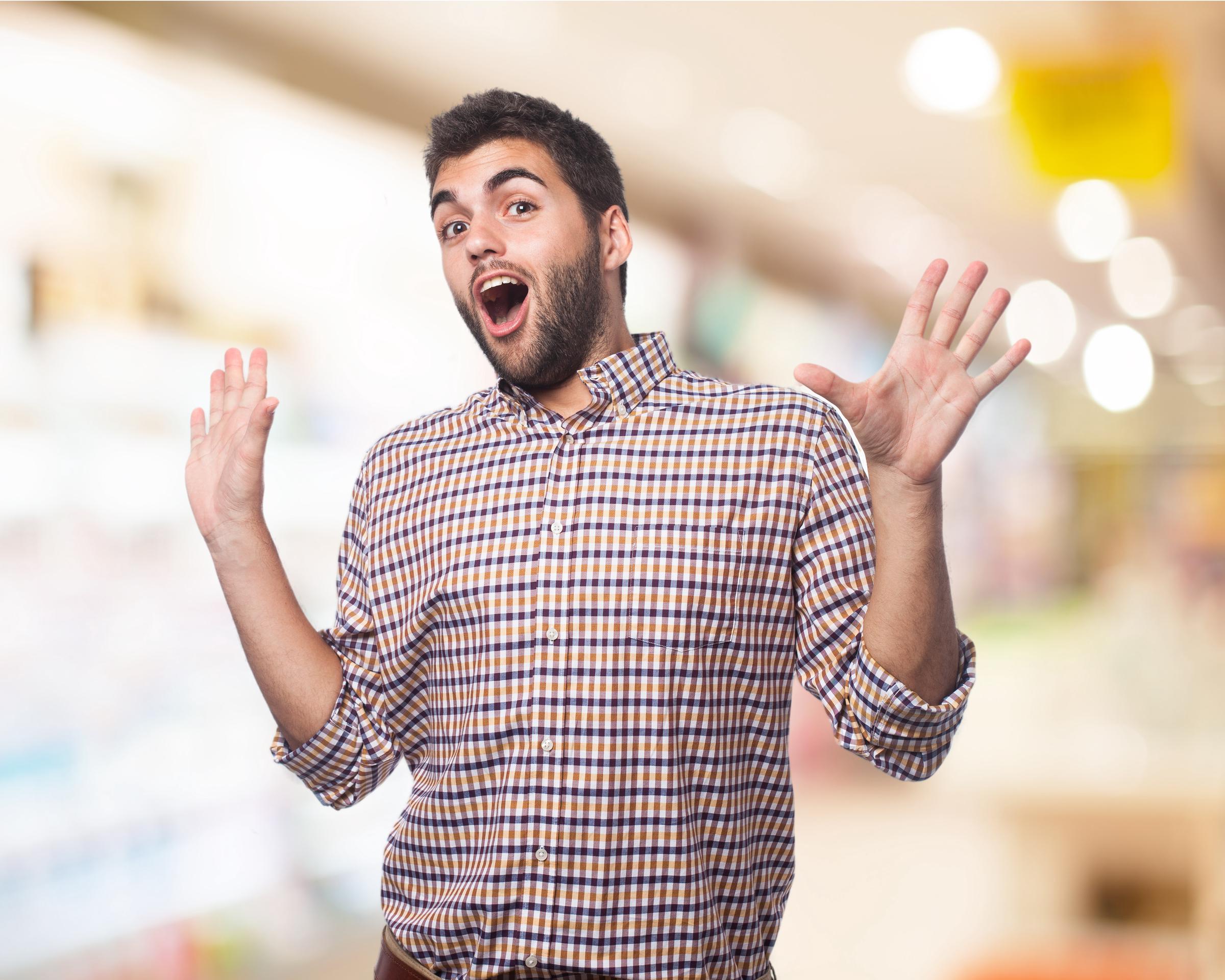 A man shouting and gesturing with his hands | Source: Freepik